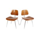 Charles and Ray Eames A pair of DCM side chair, designed in 1946 plywood on chrome frames 68cm high,