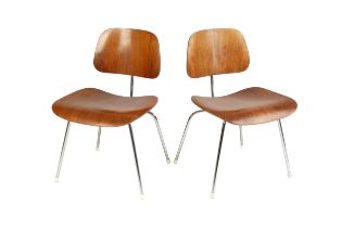 Charles and Ray Eames A pair of DCM side chair, designed in 1946 plywood on chrome frames 68cm high,