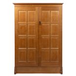 Hugh Birkett (1919-2002) Wardrobe oak, with panelled doors enclosing fitted shelves 181cm high,