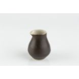 Lucie Rie (1902-1995) Miniature pourer manganese glaze impressed potter's seal 5.8cm high.
