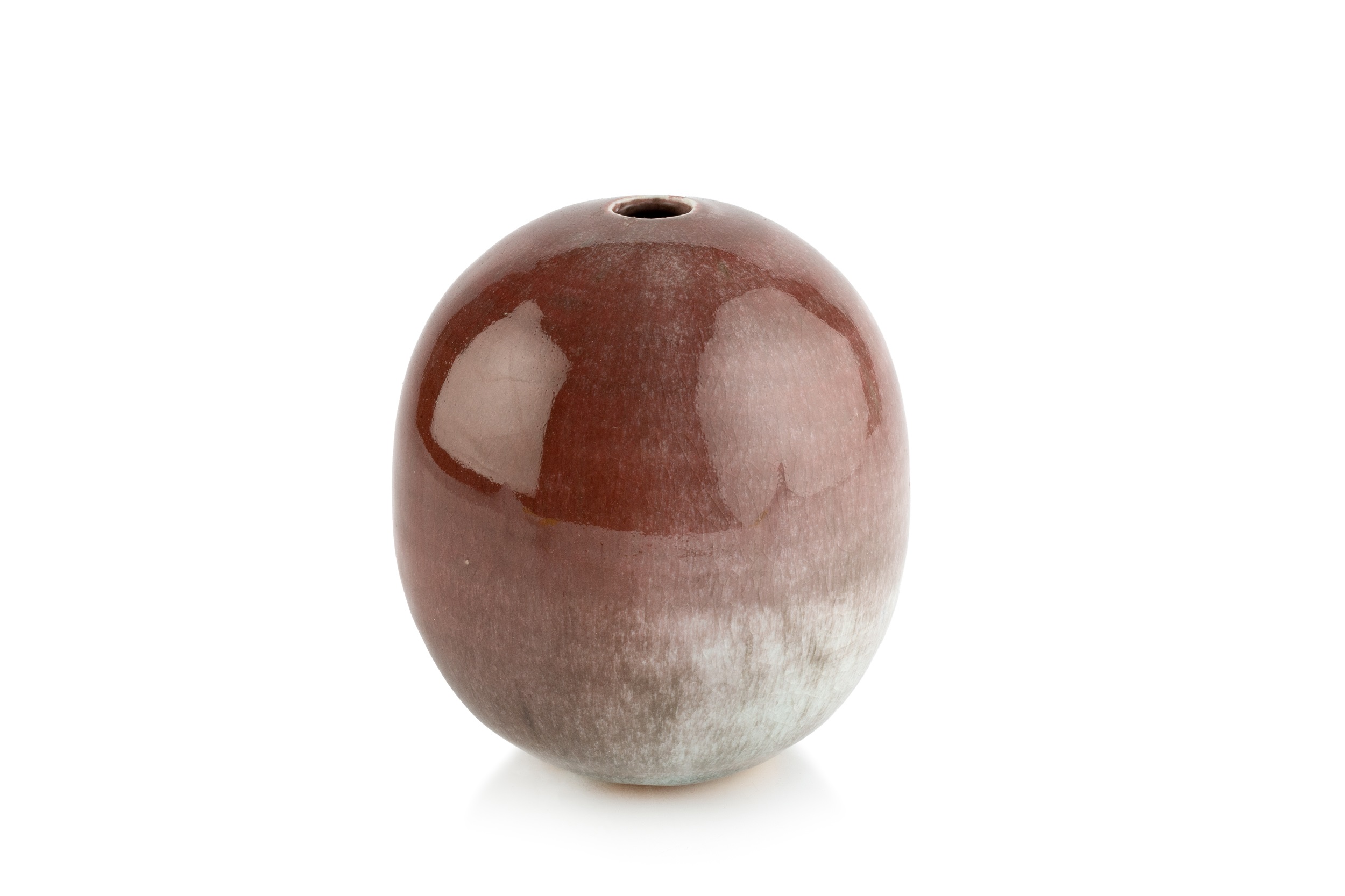 Derek Davis (1926-2008)​ Cylindrical pot red glaze with grey inclusions signed 12cm high.