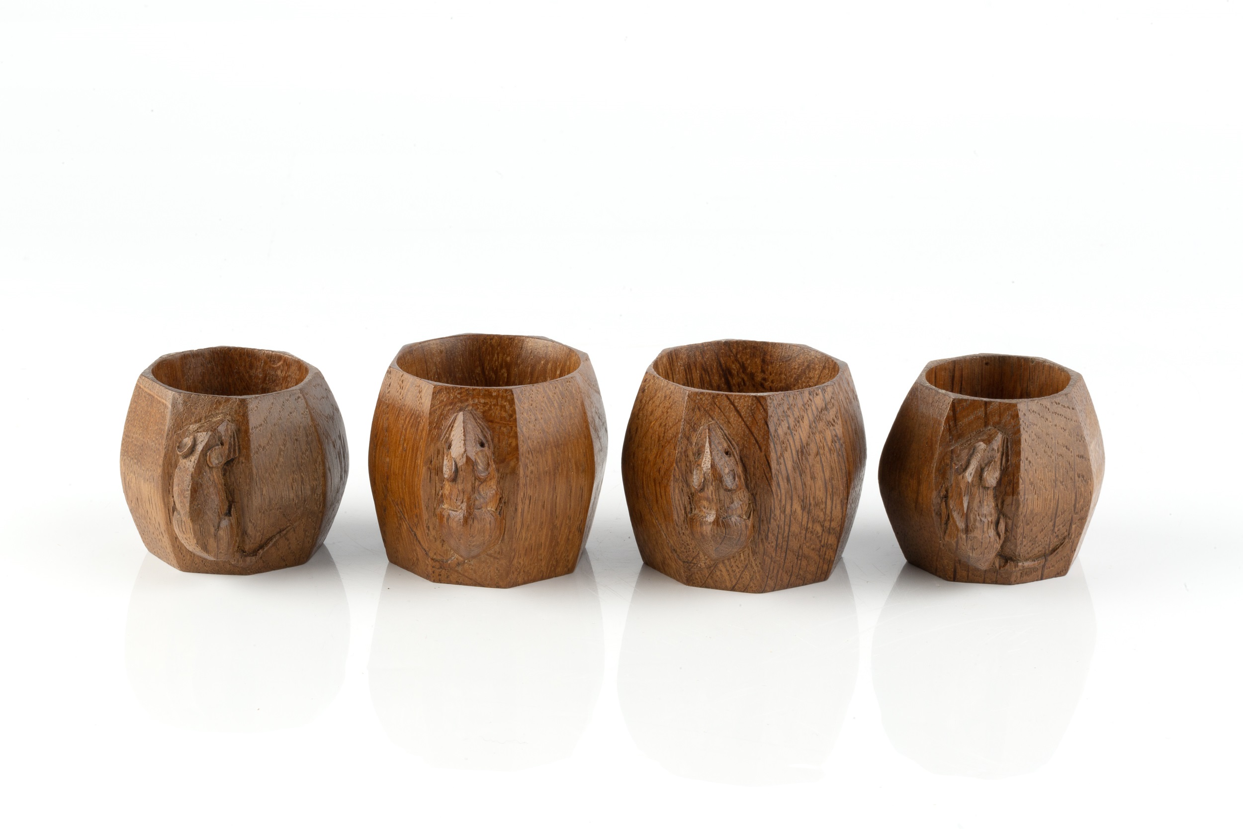 Robert Thompson of Kilburn (1876-1955) A set of four Mouseman napkin rings, circa 1970 oak carved - Image 2 of 3