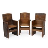 Arts & Crafts Three oak armchairs, 1934 designed for Summerfield School 92cm high (3).