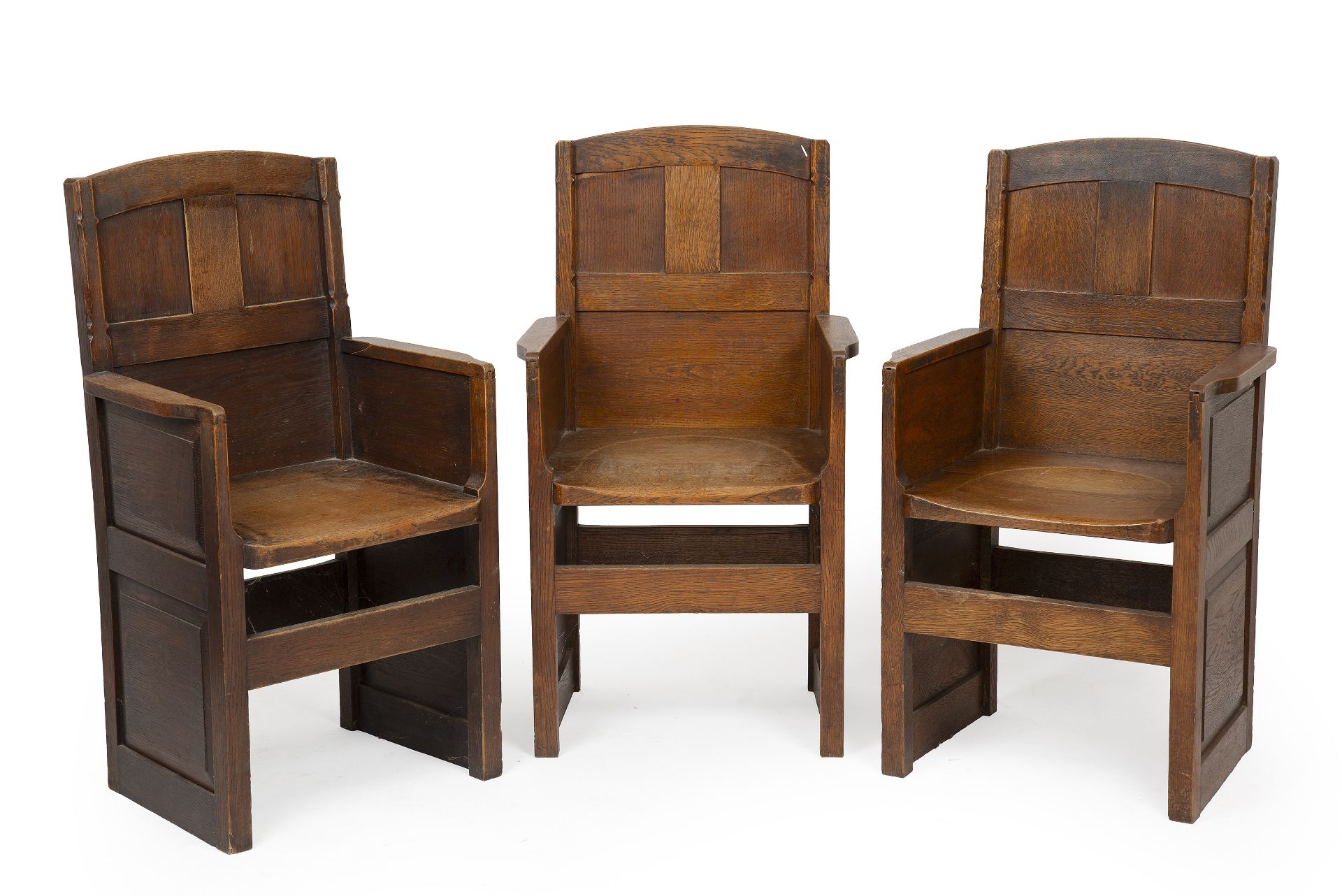 Arts & Crafts Three oak armchairs, 1934 designed for Summerfield School 92cm high (3).