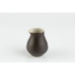 Lucie Rie (1902-1995) Miniature pourer manganese glaze impressed potter's seal 5.8cm high. Aopears