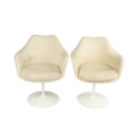 Eero Saarinen (1910-1961) A pair of Tulip chairs with fabric upholstery on white bases 84cm high,
