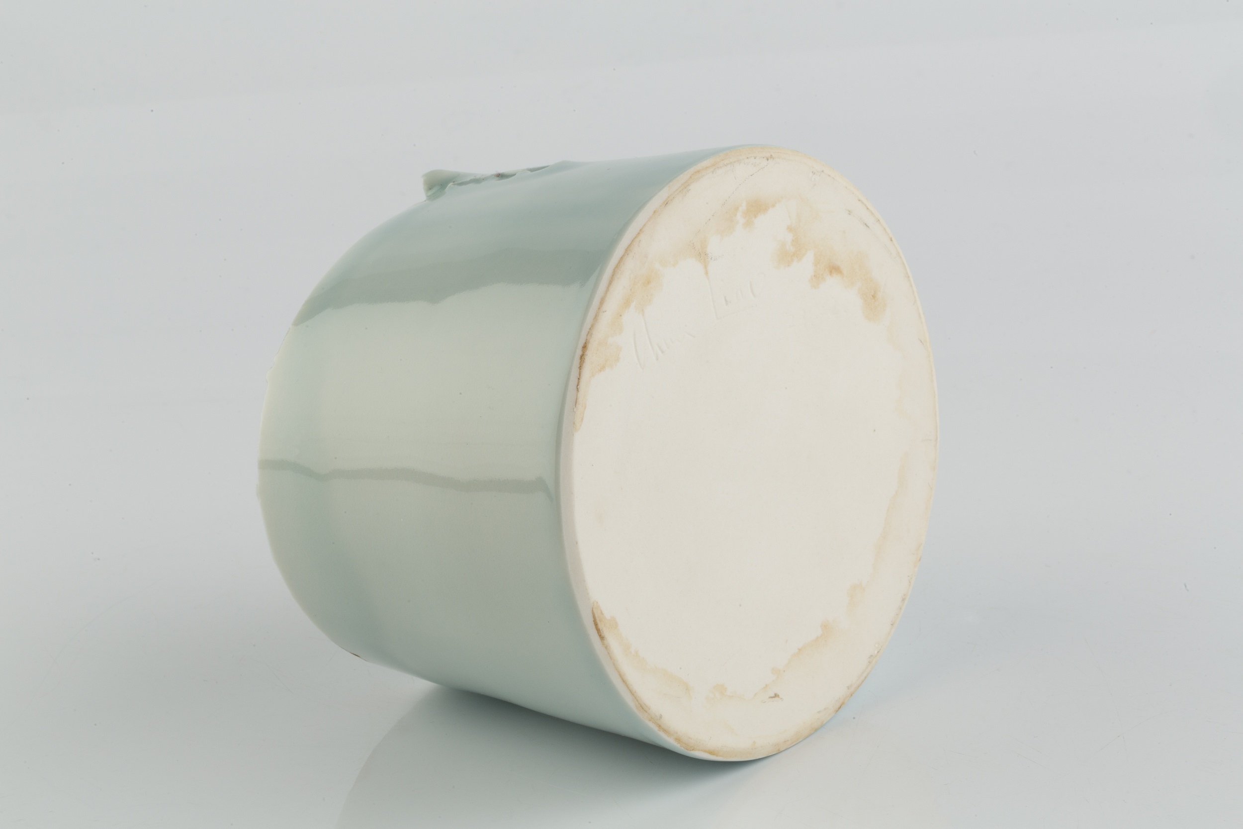 Chun Liao (b.1969) Cylinder porcelain, with a pale celadon glaze signed 10cm high, 11cm diameter. - Image 3 of 3