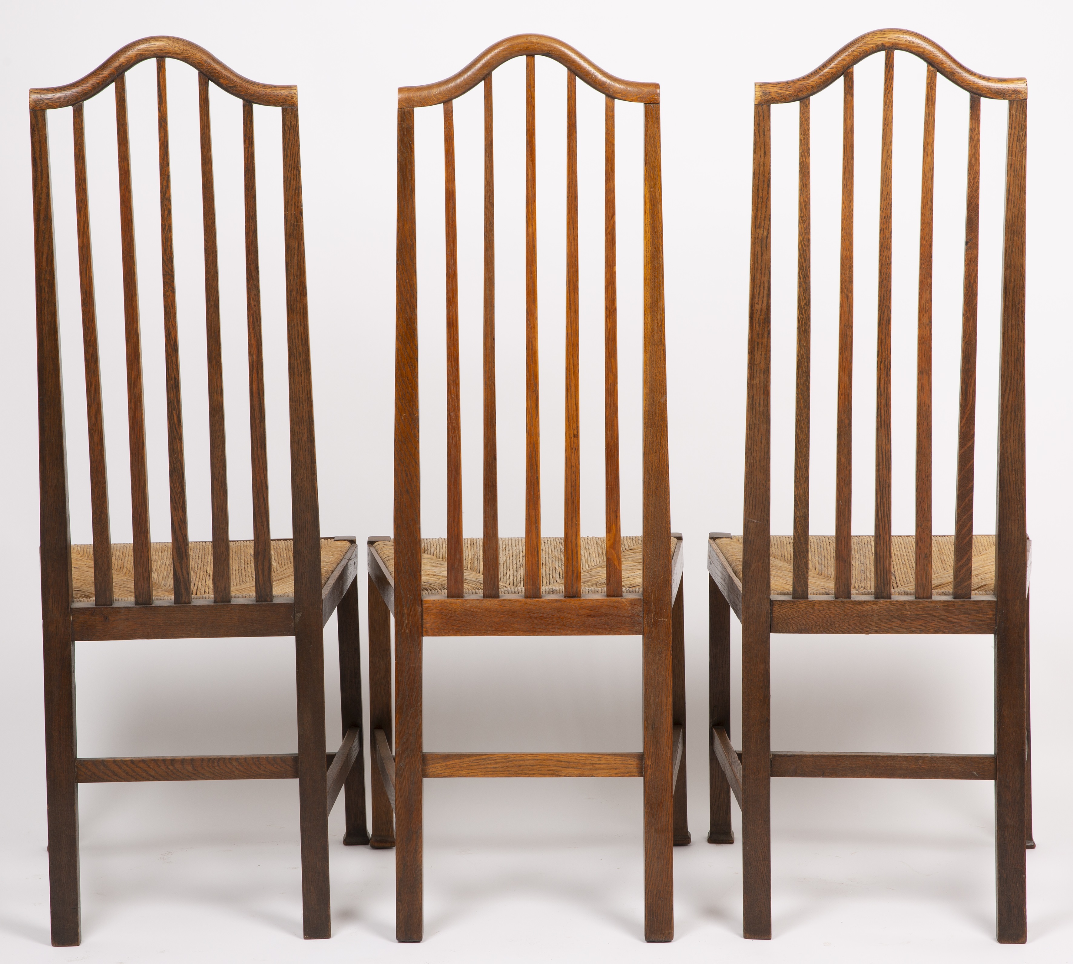 Arts & Crafts A set of six dining chairs, circa 1900 oak with rush seats 121cm high, 41cm wide (6). - Image 2 of 3