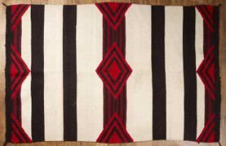 Black and white striped chieftain's Navaho rug with a geometric design in red, approximately 119cm x