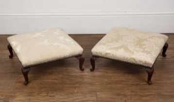 Pair of wooden footstools 19th Century, on carved cabriole legs, with cream brocade upholstery, 37cm