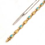 Precious yellow metal bracelet marked '585', with turquoise coloured inset panels, 19cm overall,