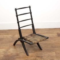 Aesthetic ebonised folding chair with the original webbed seat, 76cm high x 37cm wide With wear