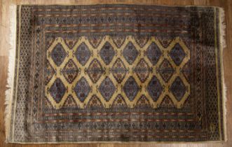 Pakistan Bokahara pattern rug of gold ground with multiple borders, 124cm x 88cm Some losses to