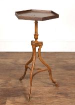 Hexagonal walnut stand with a well carved fluted column, tripod supports and hoof feet, 35cm wide