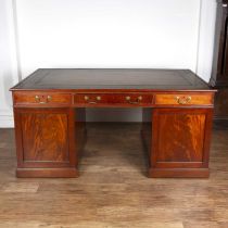 Mahogany large partners desk Georgian-style, with fitted drawers and cupboards and with brass