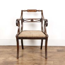 Mahogany elbow chair Regency period, with a drop in seat and on sabre legs, approximately 58cm