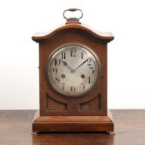 Oak cased mantel clock German, silvered convex dial, Junghans movement with gong strike, the case