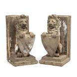 A pair of late 20th century composite stone lion bookends 11.5cm wide 22cm high