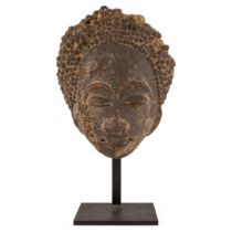 An antique African pottery head, possibly Akan, Ghana 15cm wide 20cm high Provenance A private