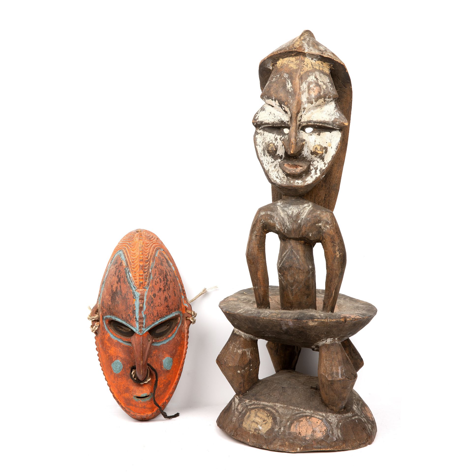 A Papua New Guinea, middle Sepik stool 22cm wide 57cm high together with a coastal Sepik mask 15cm