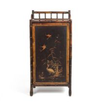 A late 19th century lacquered bamboo cabinet with a single door opening to reveal six drawers 47cm
