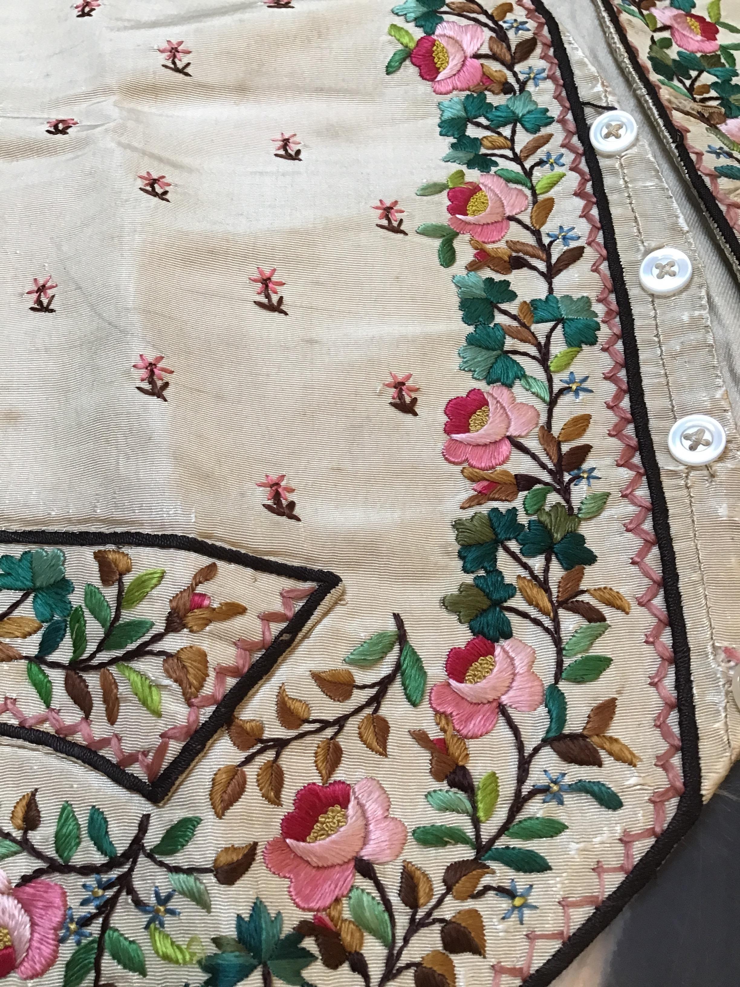 A Georgian silk embroidered waistcoat, decorated with flowers. Stains, marks.  Fraying around button - Image 19 of 24