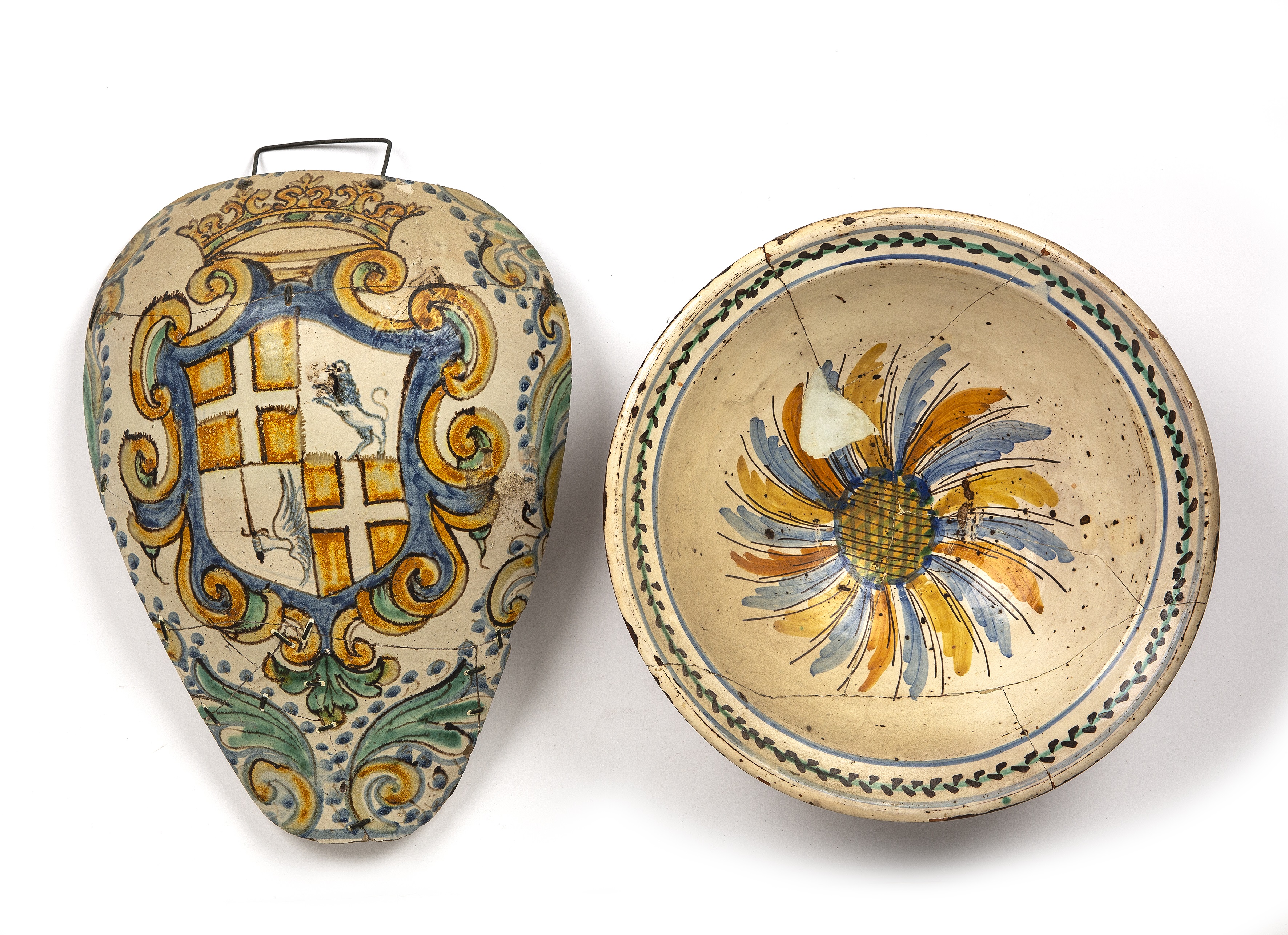 A 19th century French tin glazed bowl, 34cm diameter together with an Italian Majolica fragment