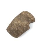 An antique native American stone axe head 6cm x 12cm