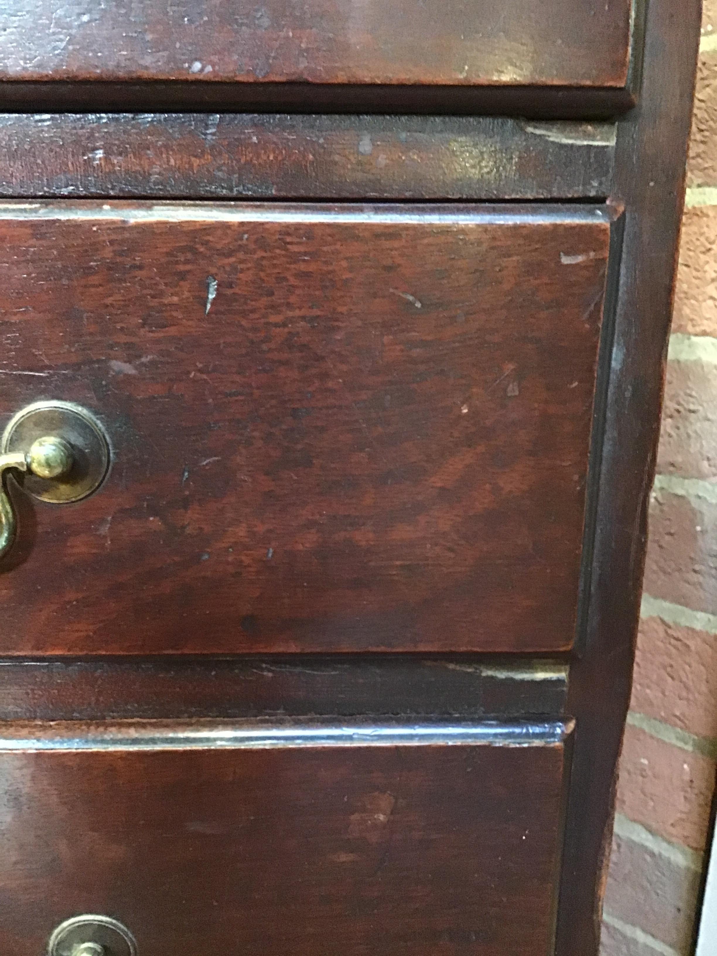 A George III mahogany chest of four long drawers having brass swan neck handles, a brushing slide - Image 11 of 31