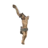 A 17th/18th century polychrome carved limewood figure of Christ 29cm in length.