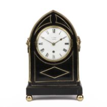 A mid 19th century ebonised mantle clock with brass decoration, the enamelled dial, signed W Terry
