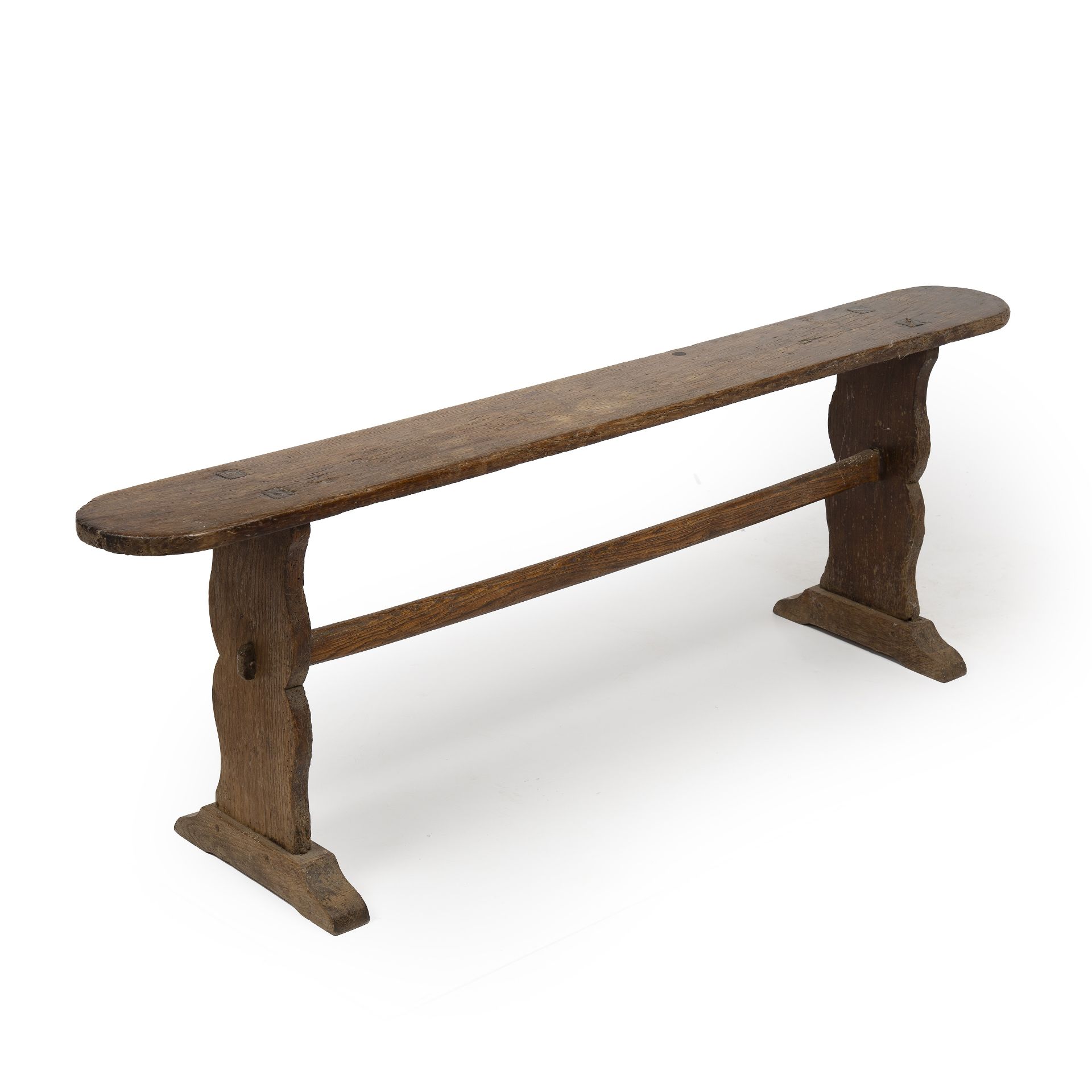 A 19th century elm bench with shaped ends united by a stretcher 140cm wide 32cm deep 47cm high