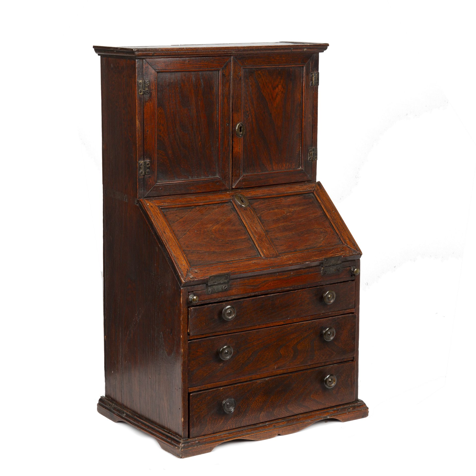 An 18th century elm apprentice bureau bookcase with panelled doors above a fall front three