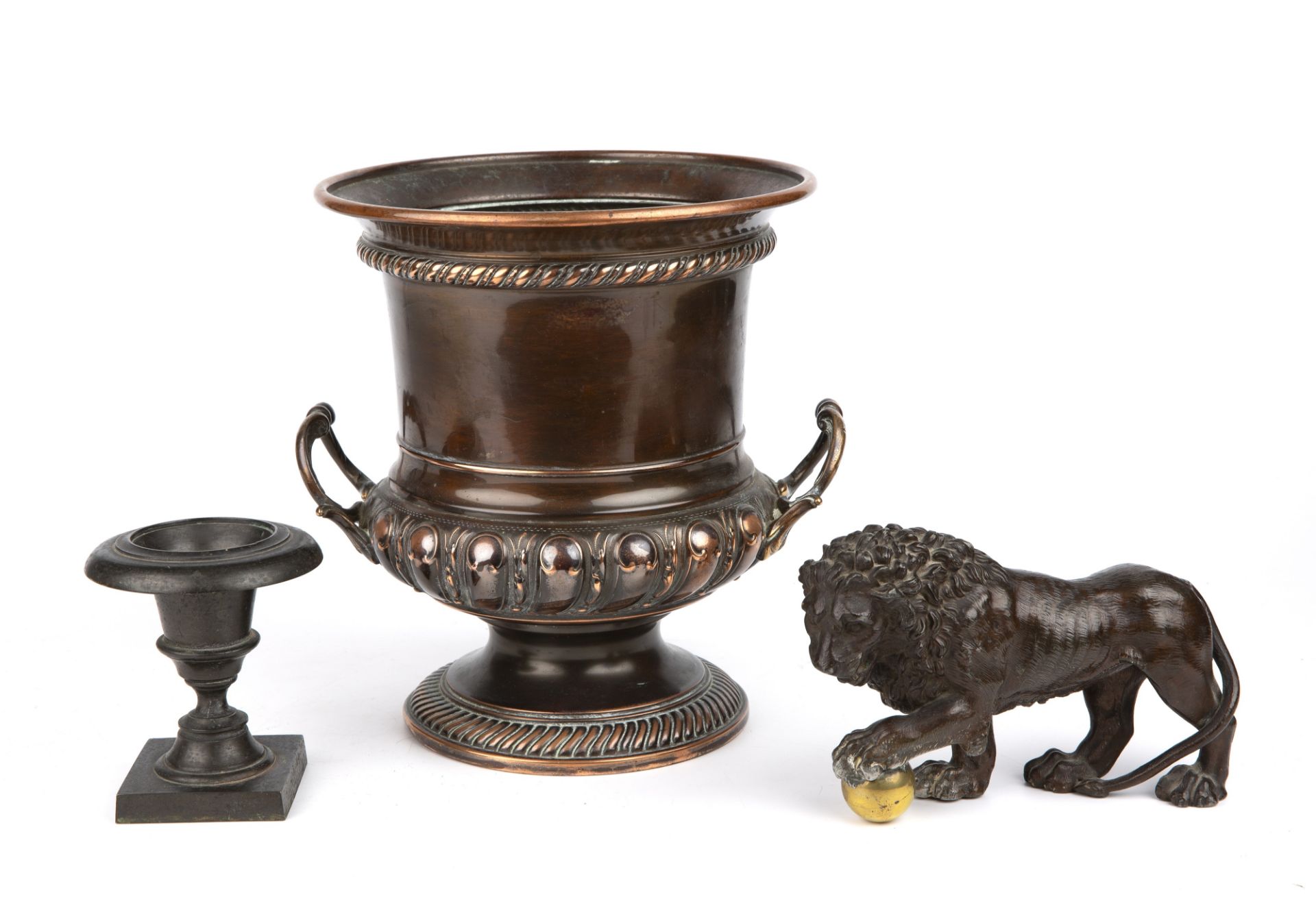 A 19th century grand tour bronze urn 10cm wide 11cm high together with a bronzed spelter lion 18cm