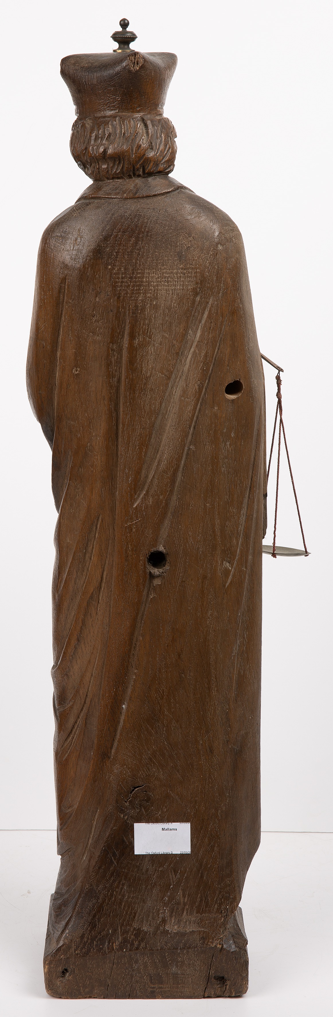 A early 19th century carved oak figure of a priest 16cm wide 65cm high. Corner missing to the - Image 2 of 2
