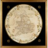 A 19th century embroidered map of England and Wales with a floral border 54cm diameter. mounted in a