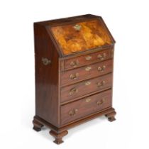 A 19th century walnut bureau of small proportions, the fall front opening to reveal small drawers