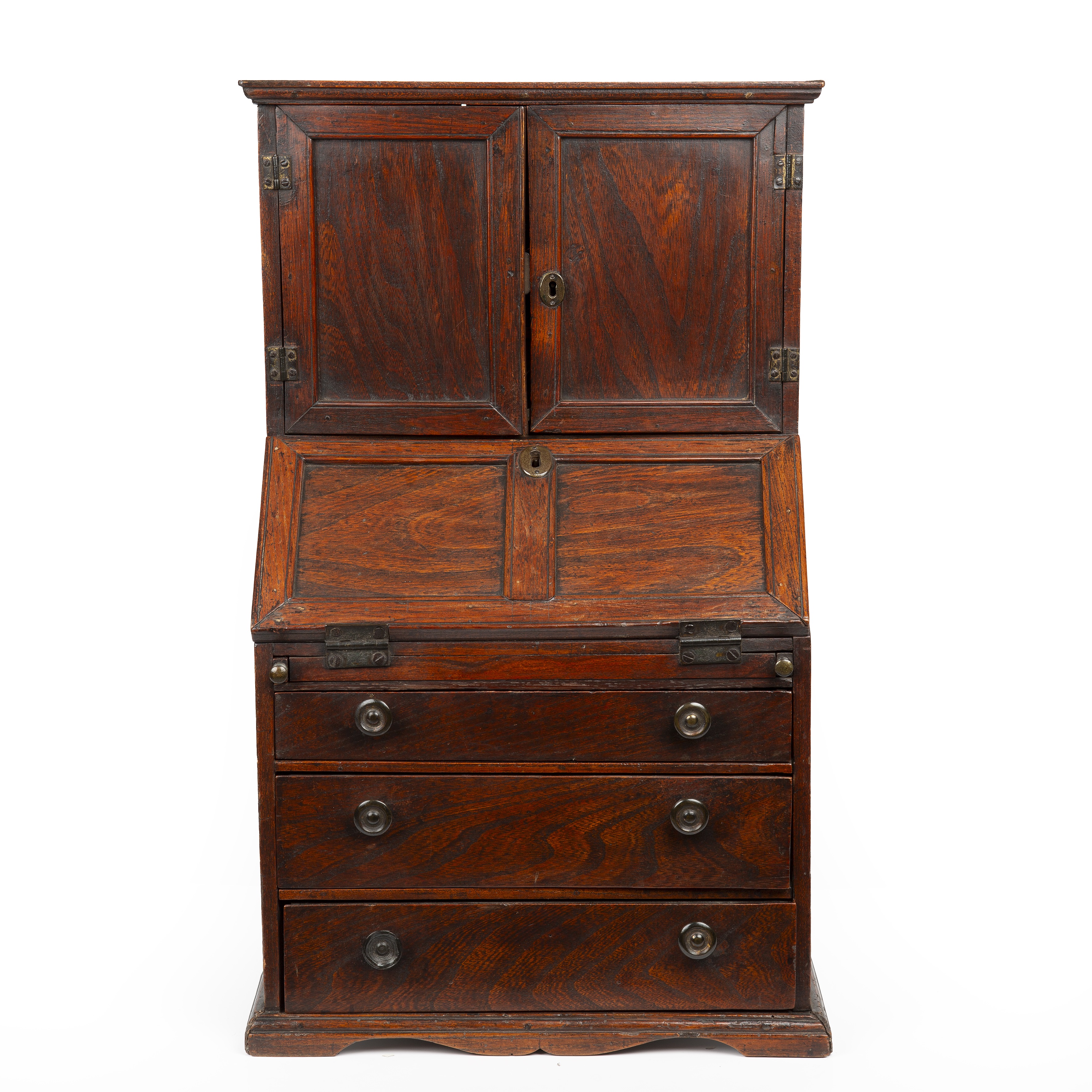 An 18th century elm apprentice bureau bookcase with panelled doors above a fall front three - Image 2 of 26