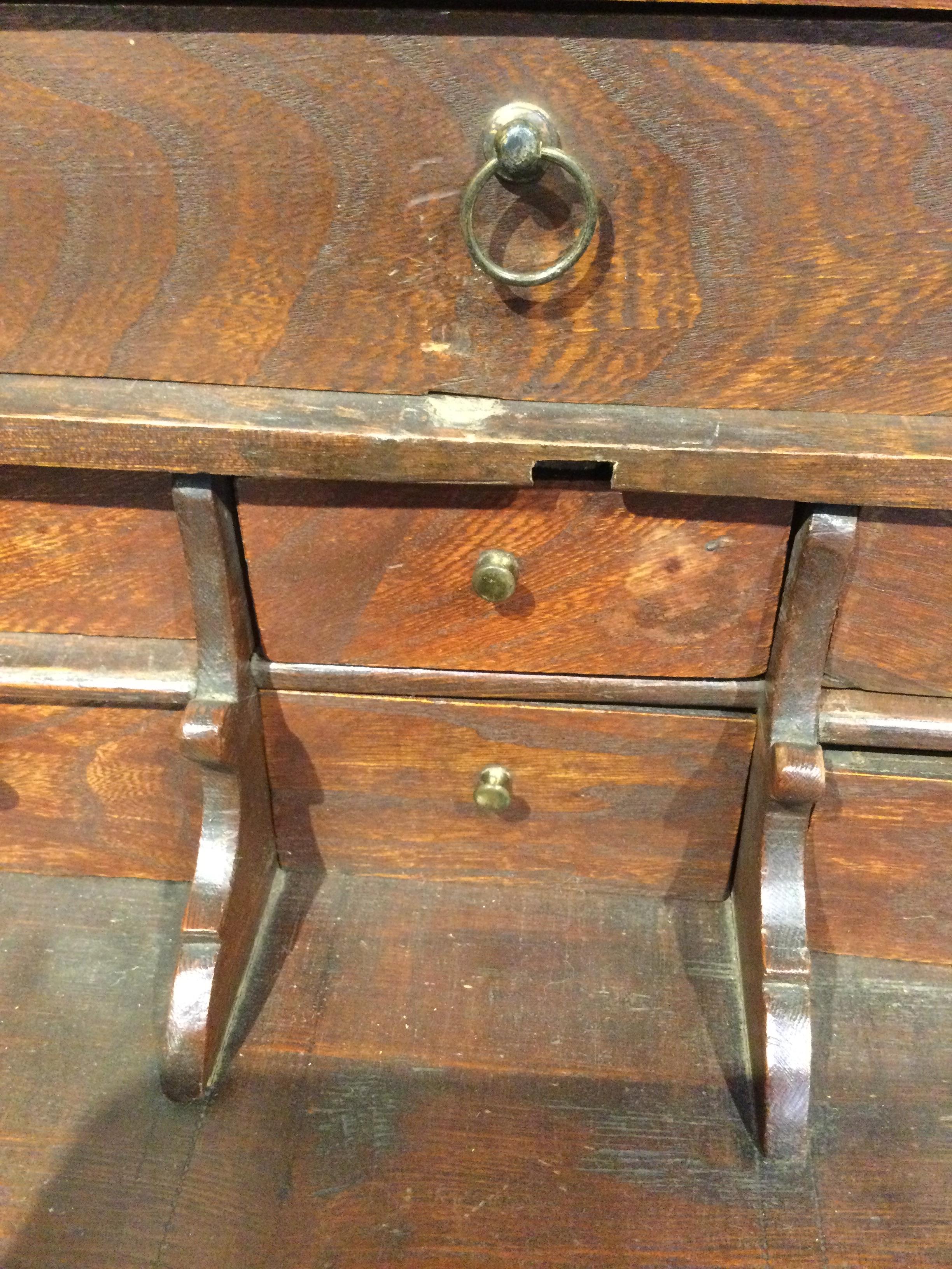 An 18th century elm apprentice bureau bookcase with panelled doors above a fall front three - Image 23 of 26