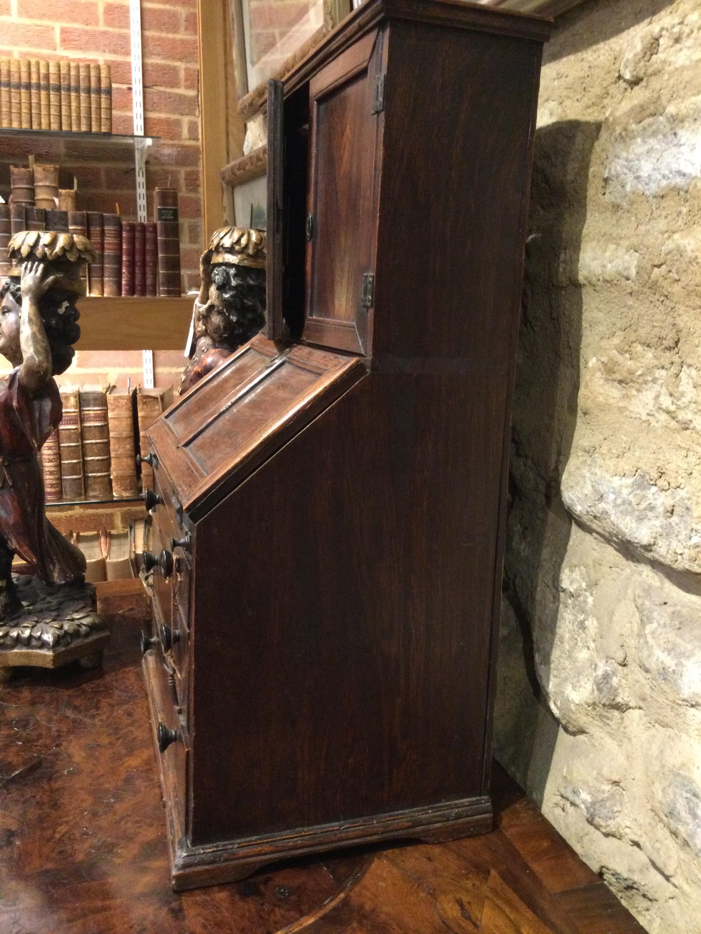 An 18th century elm apprentice bureau bookcase with panelled doors above a fall front three - Image 9 of 26