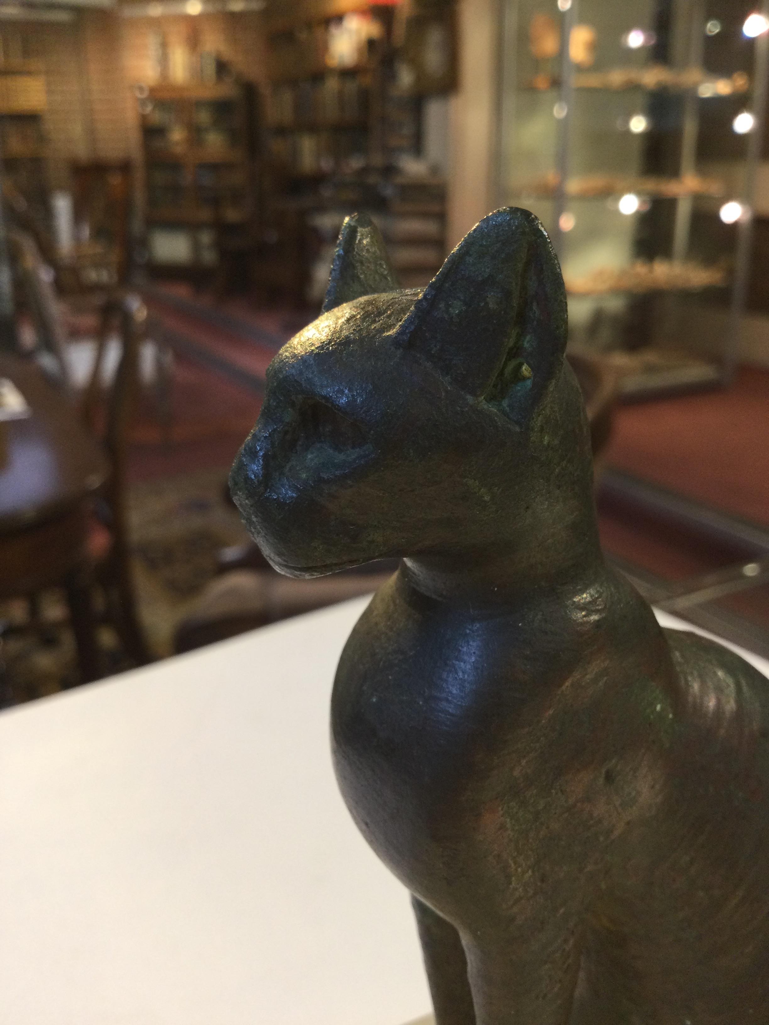 An Egyptian bronze cat figure , hollow cast, depicted seated and alert with forepaws together and - Image 25 of 26