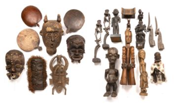 African tribal art to include mask and Igbo and a Yoruba figures