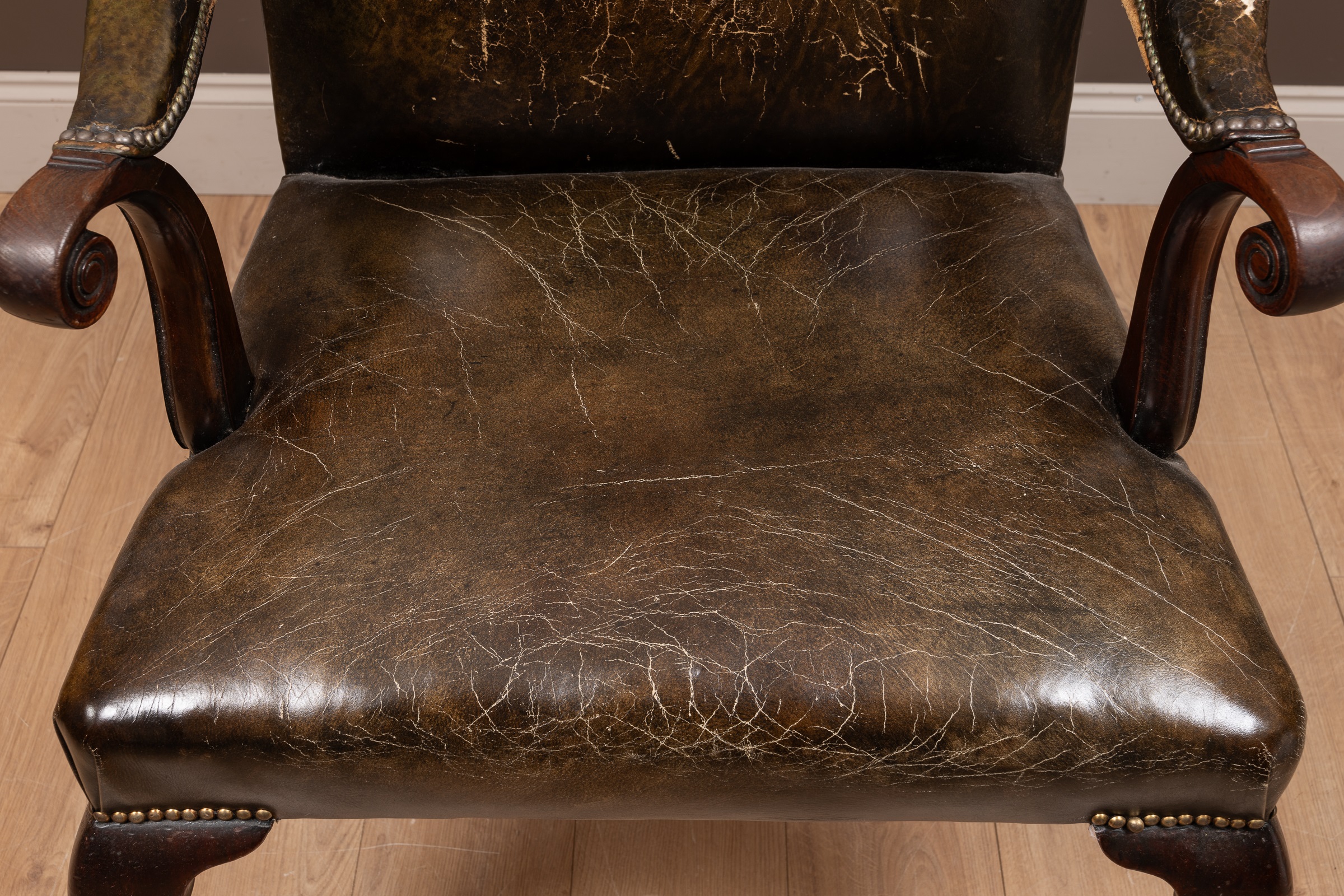 A George III mahogany framed leather upholstered library chair with a shaped back, scrolling arm - Image 8 of 9