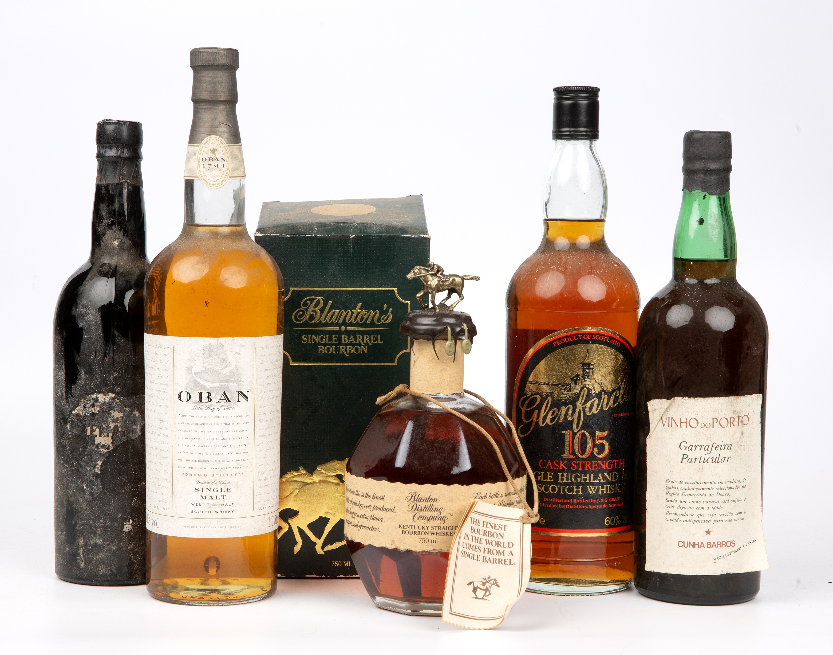 A litre bottle of Oban single malt Whisky, Blanton's single barrel bourbon, a litre bottle of
