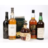 A litre bottle of Oban single malt Whisky, Blanton's single barrel bourbon, a litre bottle of