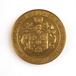 An 18 carat gold medallion Stonyhurst college Lancashire, In Oratione Anglica Bene Merenti, by
