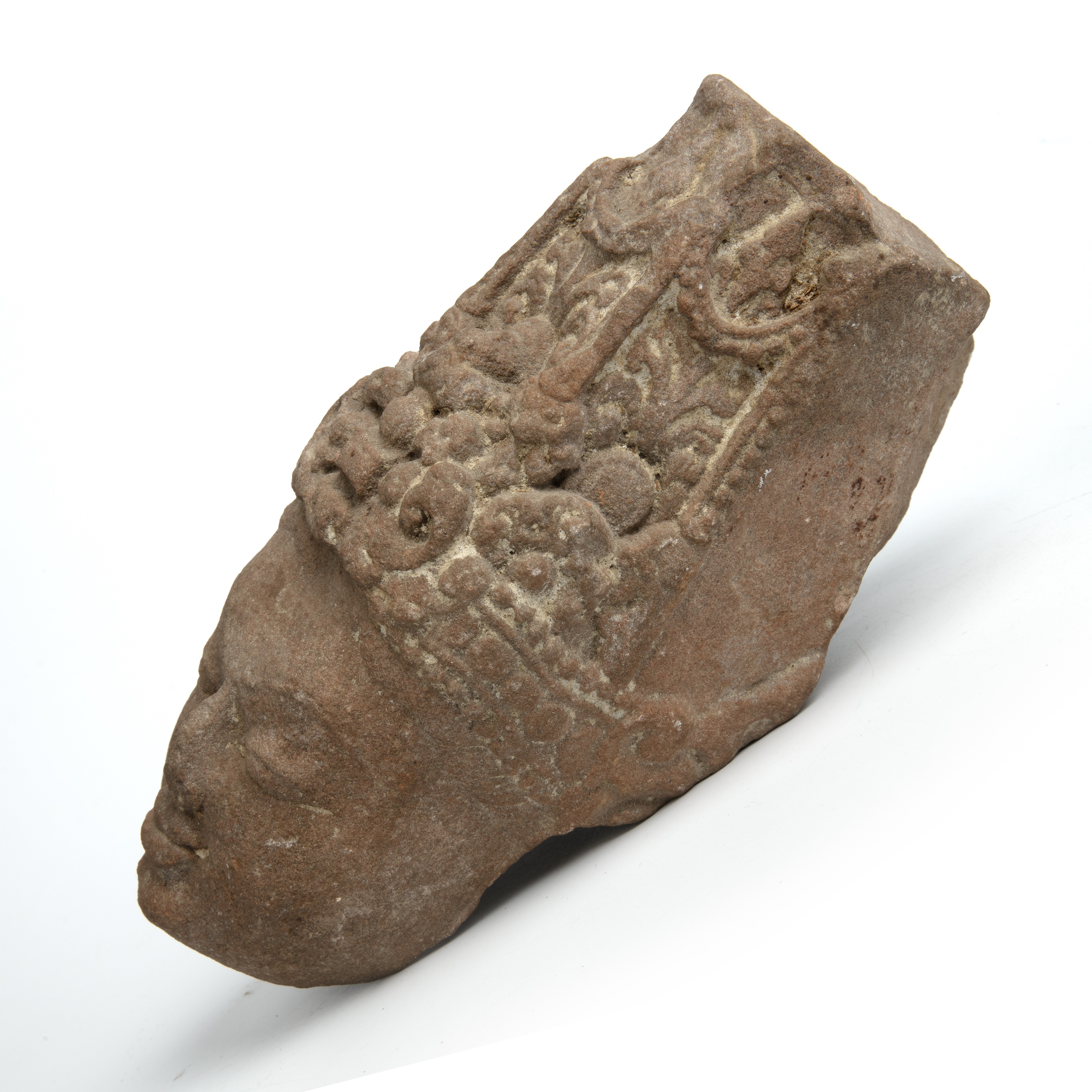 An ancient Indian sandstone head of a Deity 9cm wide 19cm high Provenance A private estate since the - Image 2 of 3