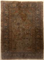 An antique Persian rug decorated with flora and fauna 80cm x 110cm