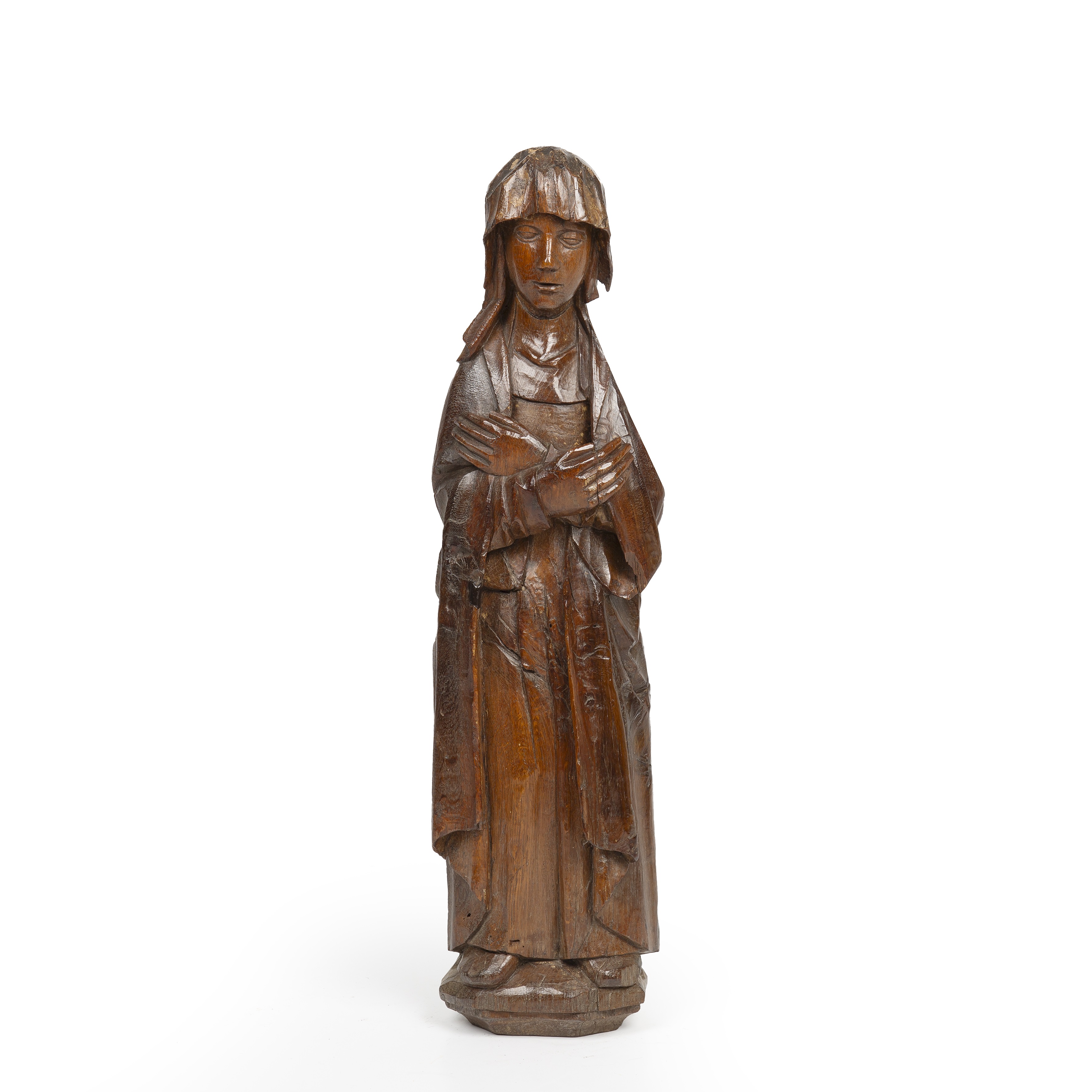 A 15th century Norfolk carved oak folk sculpture depicting Saint Anne 21cm wide 77cm high.