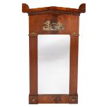 A French Empire style mahogany framed wall mirror the pedimented top above a brass mount of Apollo